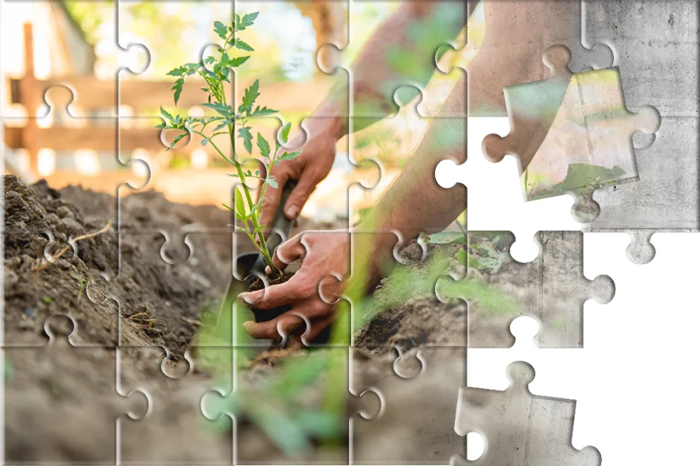 Puzzle mit Motiv  von gärtnernden Händen